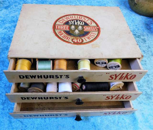 A Dewhurst sylko sewing chest with mixed contents