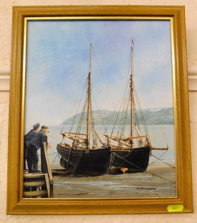 An oil on panel of moored boats signed Hannaford i