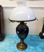 A brass & ceramic oil lamp with glass shade