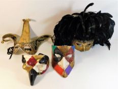 Four vintage Venetian ball masks