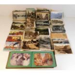 A quantity of postcards including a pre-war Britis