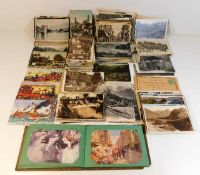 A quantity of postcards including a pre-war Britis