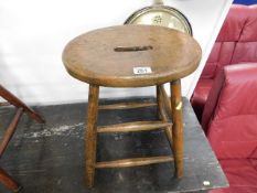 An antique elm seated stool 21.75in high