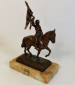 A marble mounted copper figure of French heroine J