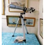 A Celestron telescope with stand