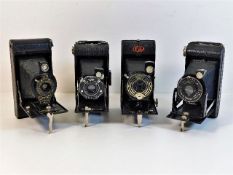 Four folding cameras including Brownie, Ensign & K