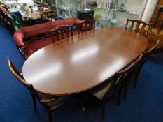 A G-Plan teak extending dining table with six chai