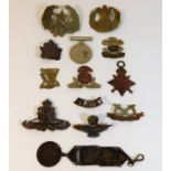 A quantity of cap badges & two medals