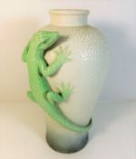 A decorative vase with applied lizard decor 13.5in