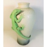 A decorative vase with applied lizard decor 13.5in