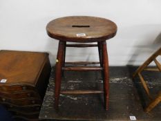 An antique elm seated stool 24in high