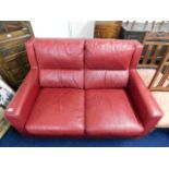 An Italian leather red two seater leather sofa
