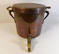 An early 19thC. copper stock pot with brass tap (t