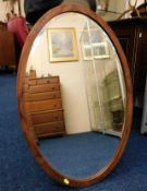 A mahogany framed oval mirror 30in x 19in & one smaller