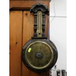 An aneroid barometer with thermometer 18.5in tall