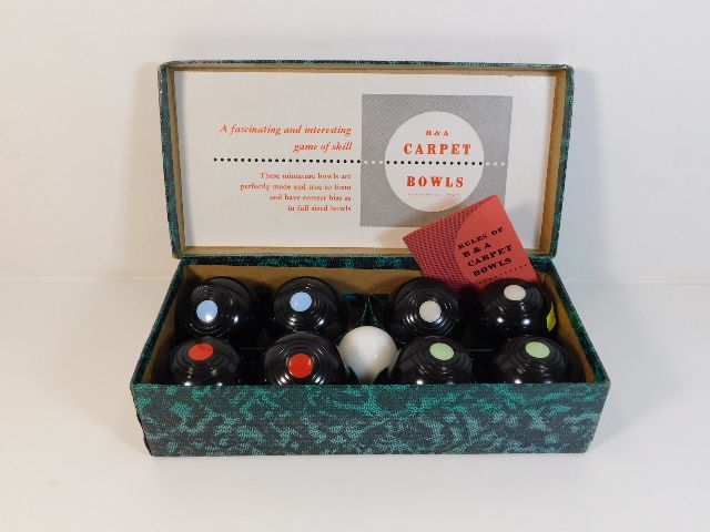 A boxed set of B&A carpet bowls