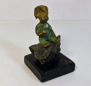 A 1972 Malcolm Moran bronze figure of boy sitting