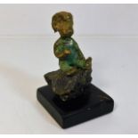 A 1972 Malcolm Moran bronze figure of boy sitting