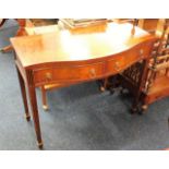 A serpentine fronted two drawer mahogany hall tabl