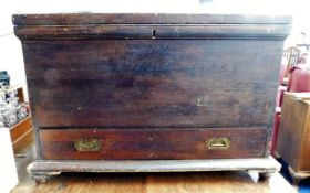 An early 20thC. pine "sea chest" with key, set wit