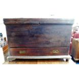 An early 20thC. pine "sea chest" with key, set wit