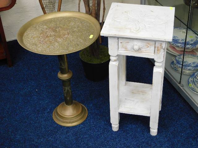 A painted table with draw twinned with a brass tab