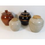 Two Oriental stoneware ginger jars with later cove