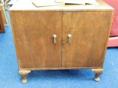 A small footed two door cupboard 33in wide x 31in