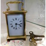 A French brass carriage clock with keys