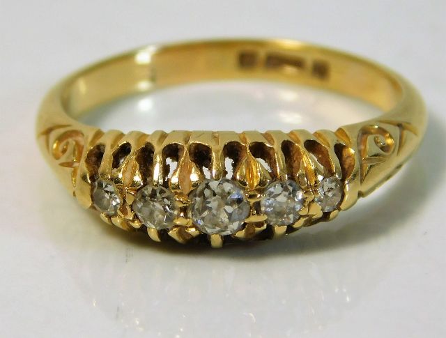 An antique 18ct gold five stone diamond ring appro