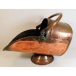 A copper coal scuttle 18in long