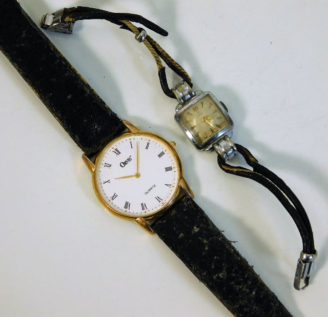 A ladies Tudor wrist watch twinned with a quartz O