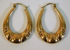 A pair of 9ct gold drop hoop earrings 2.8g