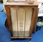 A small display cabinet with two glass shelves