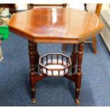 A mahogany Edwardian style octagonal table with ga