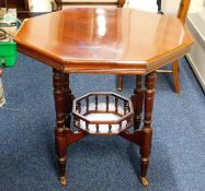 A mahogany Edwardian style octagonal table with ga