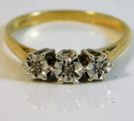 An 18ct gold ring with illusion set diamonds size