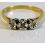 An 18ct gold ring with illusion set diamonds size