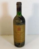 A bottle of House of Commons Claret red wine