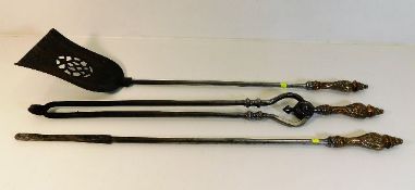 A three piece 19thC. steel companion set with deco