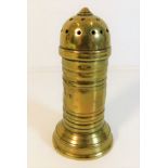 An early brass pepper shaker 4in