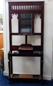 An Edwardian mahogany hall stand with mirror, coat