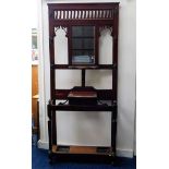 An Edwardian mahogany hall stand with mirror, coat