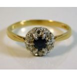 An 18ct gold ring set with diamond & sapphire with