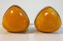 A pair of amber gents gilt mounted cufflinks, one