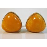 A pair of amber gents gilt mounted cufflinks, one