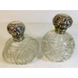Two silver topped scent bottles, one top loose & i