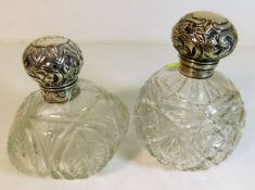 Two silver topped scent bottles, one top loose & i