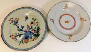 An 18thC. Chinese plate with fish decor twinned with one other, largest 9in diameter