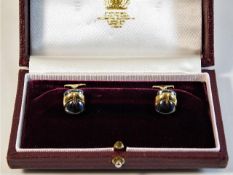 A boxed pair of Asprey 18ct gold & hematite buckle